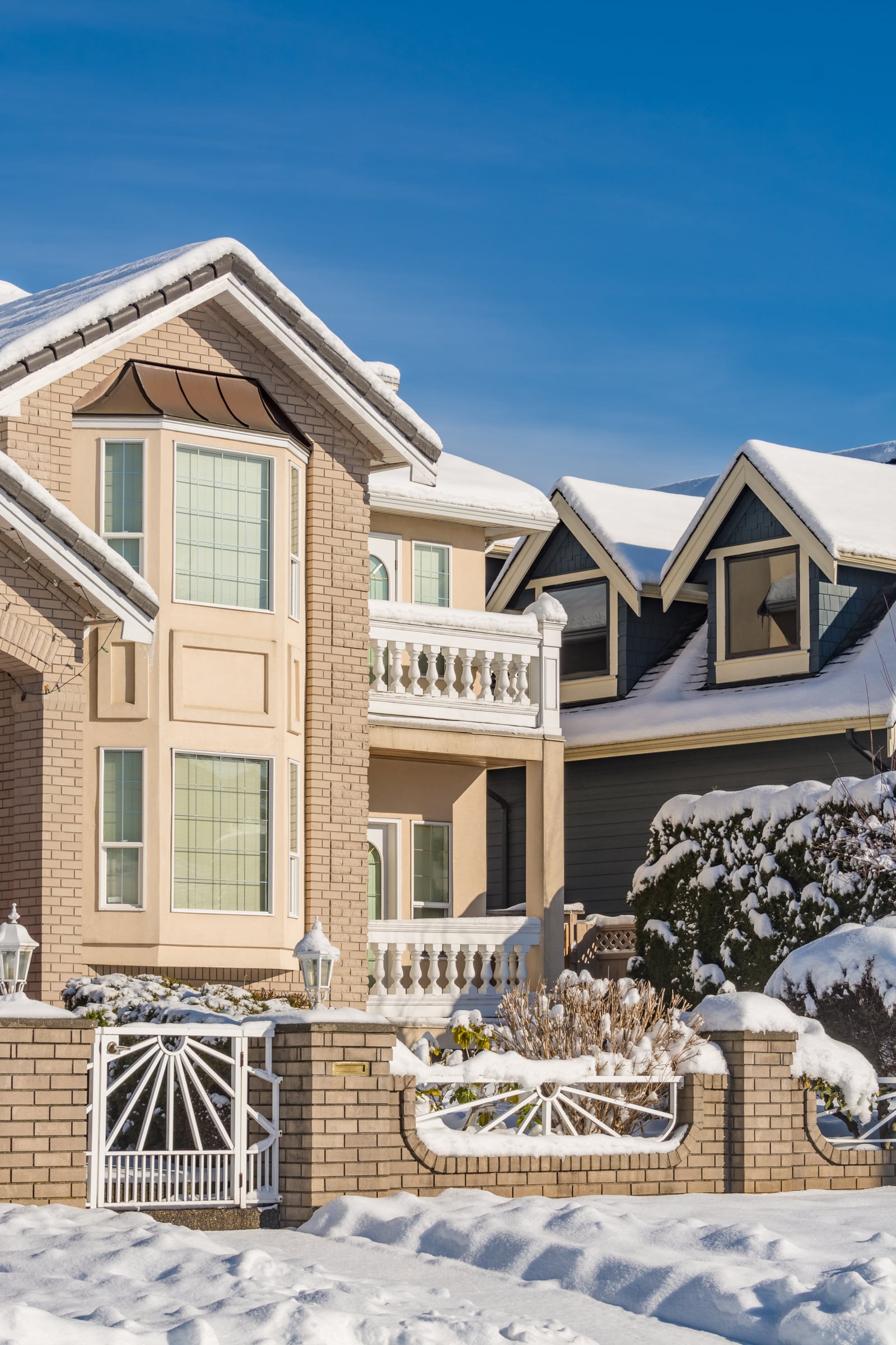 Residential driveway and walkway during professional snow clearing